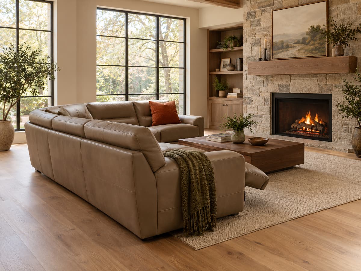 Power sectional placed in the middle of an open living room with no cords visible